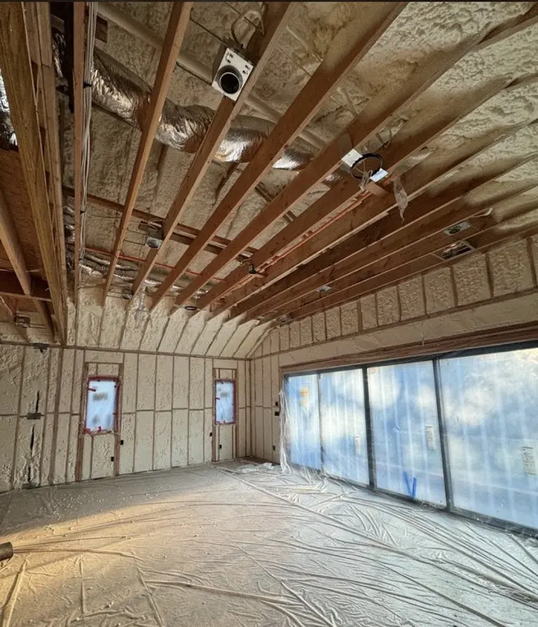 Interior walls and ceiling insulated with spray foam during new construction in Waimalu